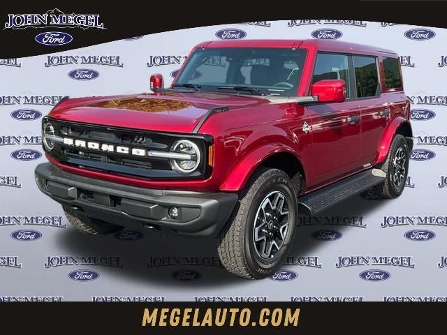 2026 Ford Bronco Outer Banks in Ruby Red Metallic — front three-quarter view