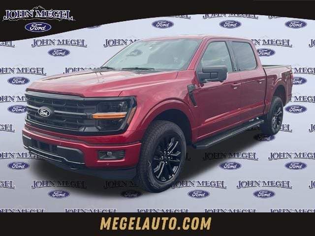 2026 Ford F-150 XLT in Ruby Red Metallic Tinted Clearcoat — front three-quarter view