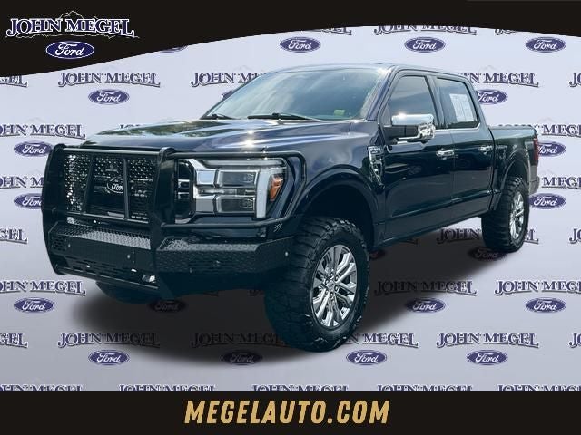 2025 Ford F-150 Lariat in Blue Metallic — front three-quarter view