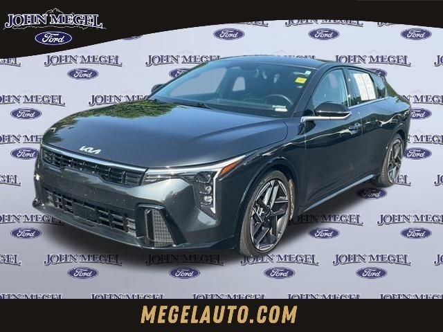 2025 Kia K4 GT-Line in Interstellar Gray — front three-quarter view