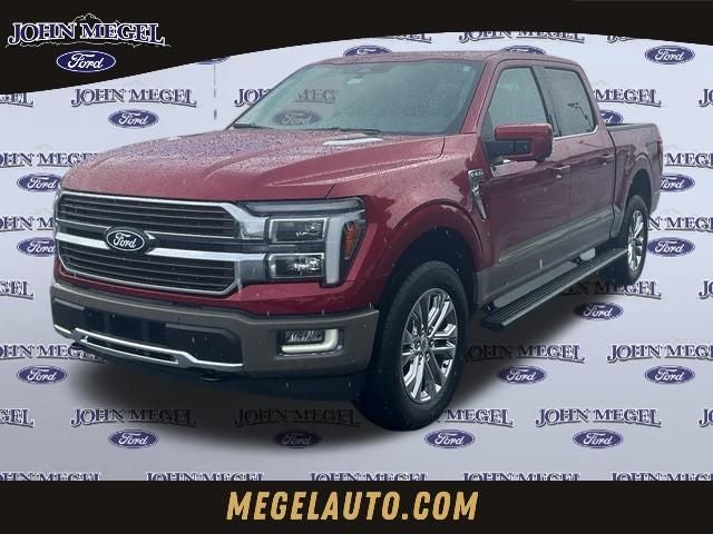 2026 Ford F-150 King Ranch in Ruby Red Metallic Tinted Clearcoat — front three-quarter view